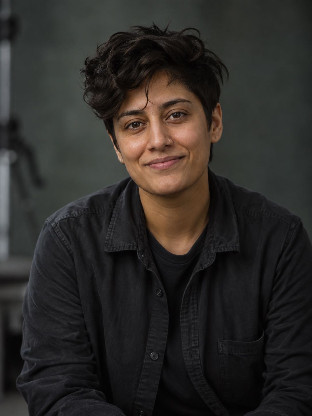 AI-generated portrait for Riley Patel's fictional sample profile